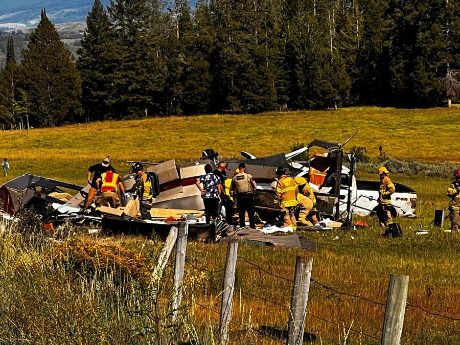 Emergency responders working a crash scene near Teton Pass